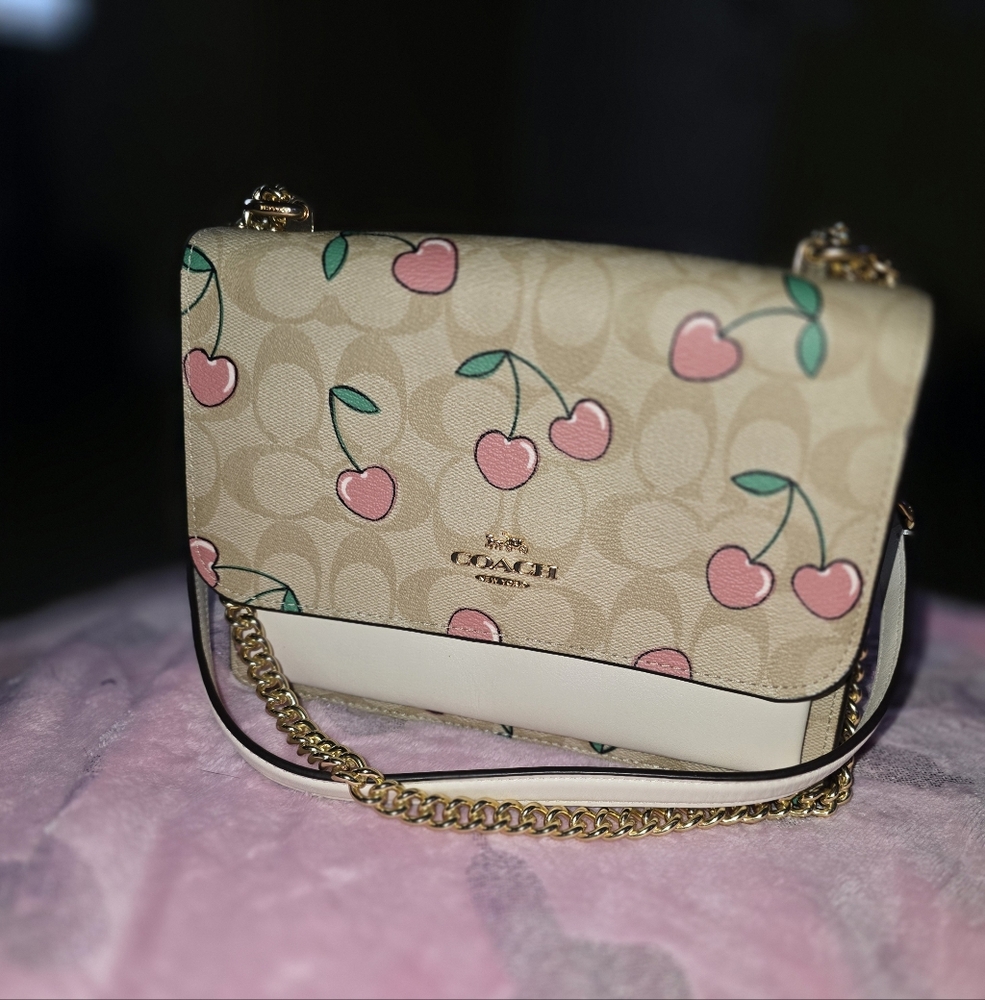 This is a Coach Klare Crossbody Bag in Signature Canvas with Heart Cherry Print